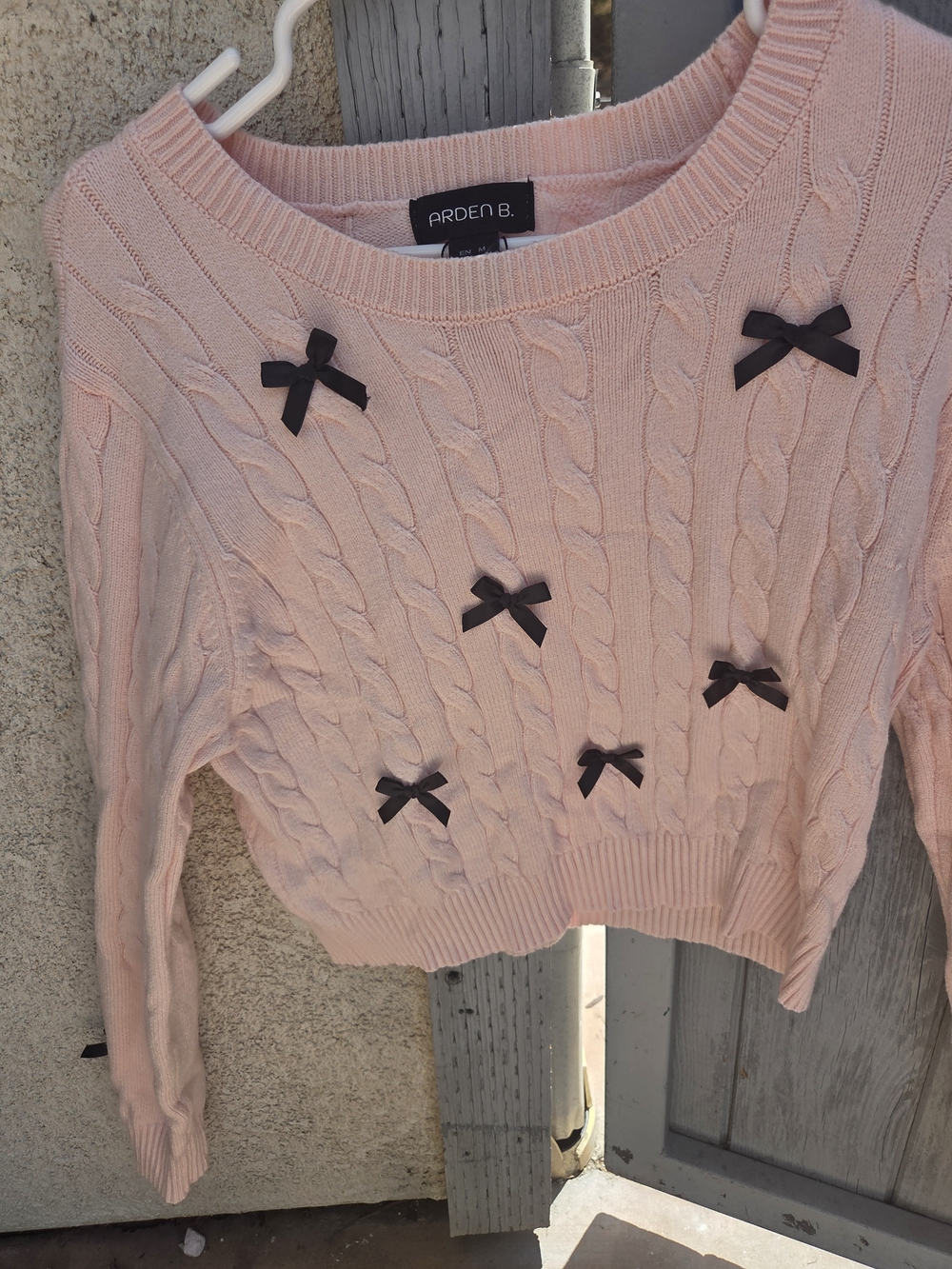 Arden B Pink Cable-Knit Crop Sweater with Black Bows